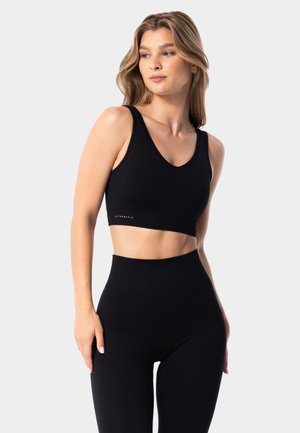 SIMPLY SEAMLESS  - Medium support sports bra - black