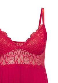 Bralette rosso in pizzo con motivo floreale, dettagli trasparenti e spalline in satin regolabili. Tessuto morbido sul fondo con una silhouette fluida.