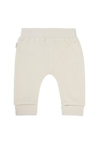 Crème-kleurige fleecebroek met een zachte textuur, voorzien van een geribbelde tailleband en boorden, en een open dijgebied.