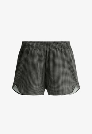 Shorts à taille élastique à petits carreaux noir et blanc, avec ourlet arrondi et tissu léger.