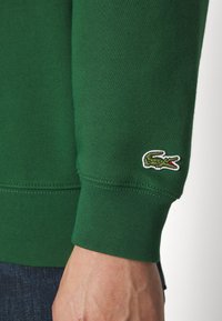 Lacoste SUBTLE LOGO UNISEX - Felpa con cappuccio - green