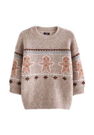 Beige strikket sweater med lange ærmer, som har et mønster af peberkagemænd, blå bølgede linjer og brune diamantformer.