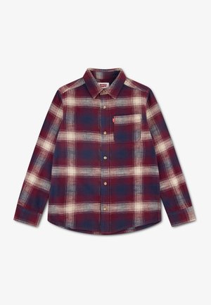 Chemise à manches longues à boutons, motif à carreaux rouges, bleu marine et blancs, une poche poitrine et col pointu.