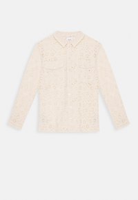 Maglia a maniche lunghe color crema con collo a camicia, caratterizzata da motivi floreali traforati, due tasche frontali e chiusura con bottoni.