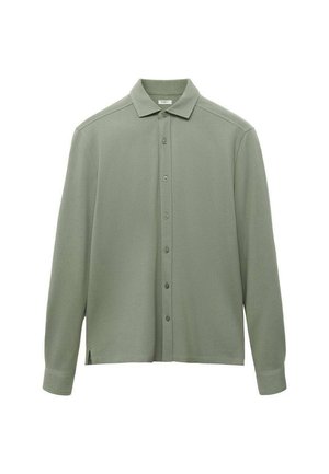 Camicia verde chiaro con colletto, maniche lunghe, dotata di una chiusura frontale con bottoni e una vestibilità ampia. Materiale morbido con dettagli di texture minimi.