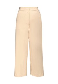Pantalons larges beiges en tissu lisse, dotés d'une taille haute avec une fermeture éclair dissimulée et de deux poches avant pour plus de fonctionnalité.