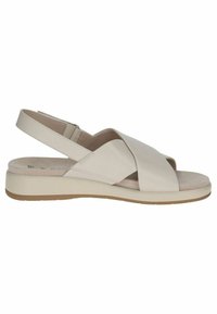 Béžové sandále na slip-on s kríženými hornými popruhmi, polstrovanou stielkou, plochou podrážkou a nastaviteľným zadným popruhom pre bezpečné uchytenie.