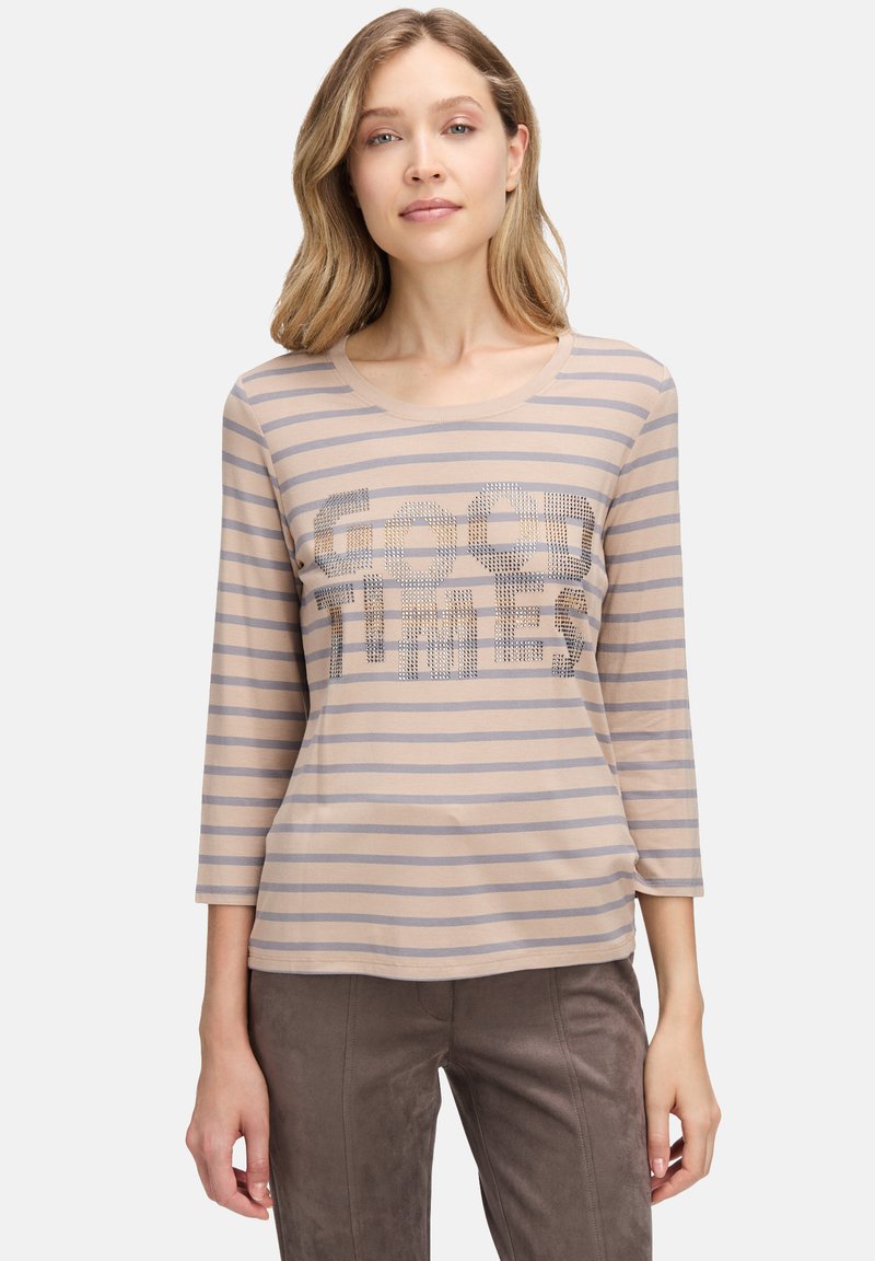 Beige Langarm-T-Shirt mit grauen Streifen, rundem Halsausschnitt und Pailletten-Aufschrift "GOOD TIMES" auf der Vorderseite. Weicher, leichter Stoff.