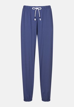 Modré jogger kalhoty vyrobené z měkké, elastické tkaniny. Obsahují elastický pas s šňůrkou a zúžené manžety u kotníků.