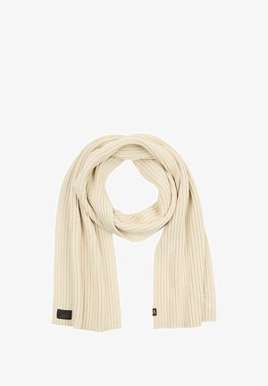 Beżowy prążkowany szalik wykonany z miękkiego materiału, z teksturowanymi pionowymi liniami i małą metką marki na jednym końcu.
