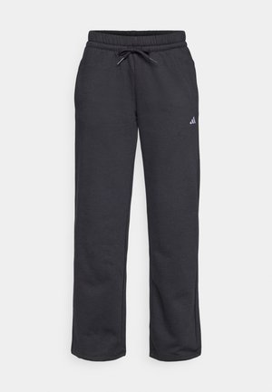 Svarte joggebukser med elastisk linning, justerbar snor, rett ben design og liten lilla logo på venstre lår. Myk stoff tekstur.