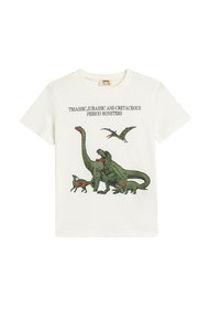 Camiseta blanca de algodón con ilustraciones de dinosaurios verdes y texto negro que dice "Monstruos de los períodos Triásico, Jurásico y Cretácico."