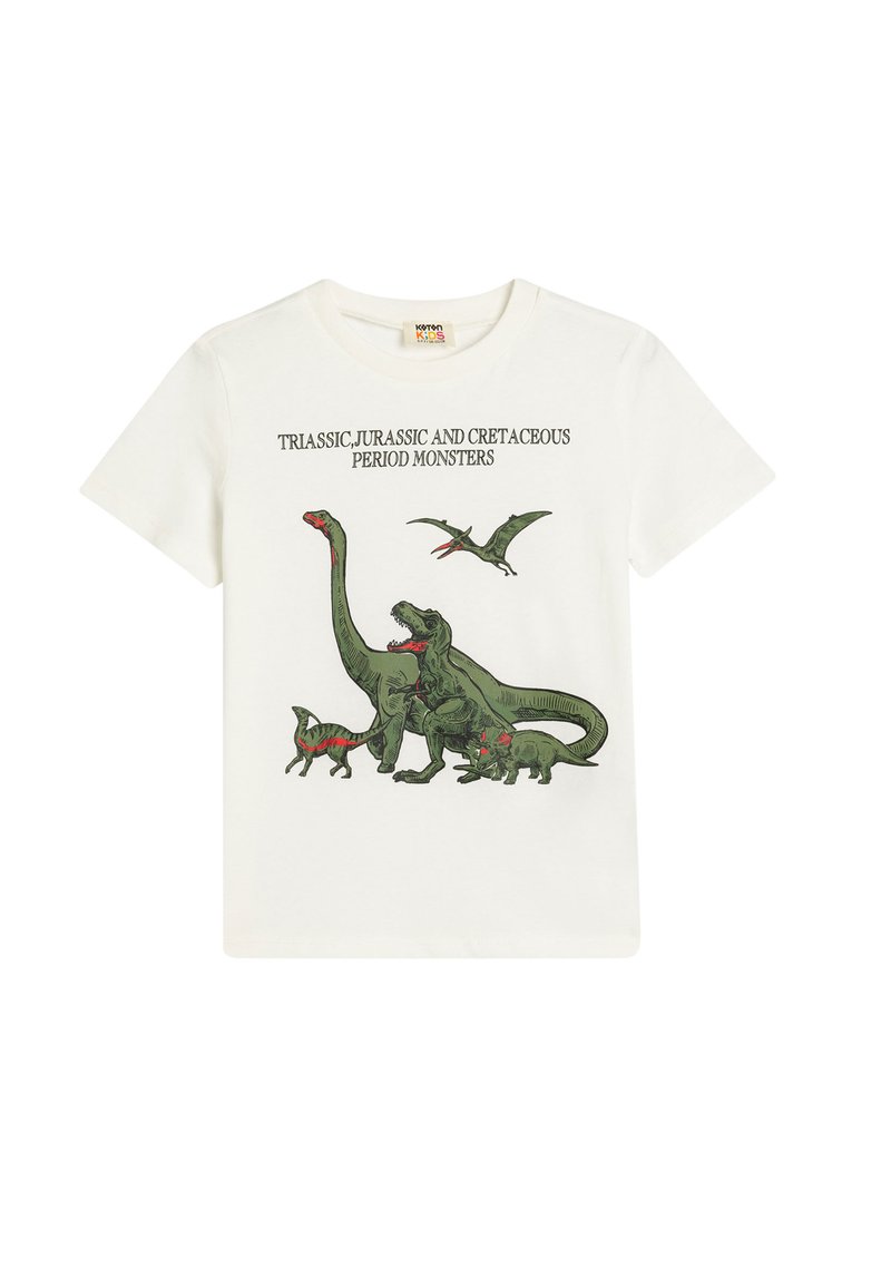 T-shirt bianco in cotone con illustrazioni di dinosauri verdi e testo nero che dice "Mostri del periodo Triassico, Giurassico e Cretaceo."