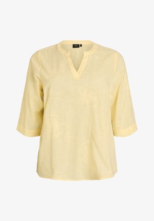 Hellgelbe Bluse mit kurzen Ärmeln, V-förmigem Ausschnitt und feinem floralen Stickmuster, aus strukturiertem Stoff, mit dem Etikett "Zizzi" Größe M.