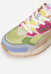 Multicolored sneaker featuring green, pink, yellow, and blue panels with suede and smooth textures. White laces and "COLMAR" branding on the side.