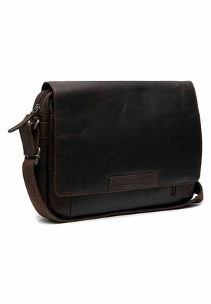 Dark brown leather messenger bag with a flap closure, adjustable strap, and front pocket. Smooth texture and minimalist design.