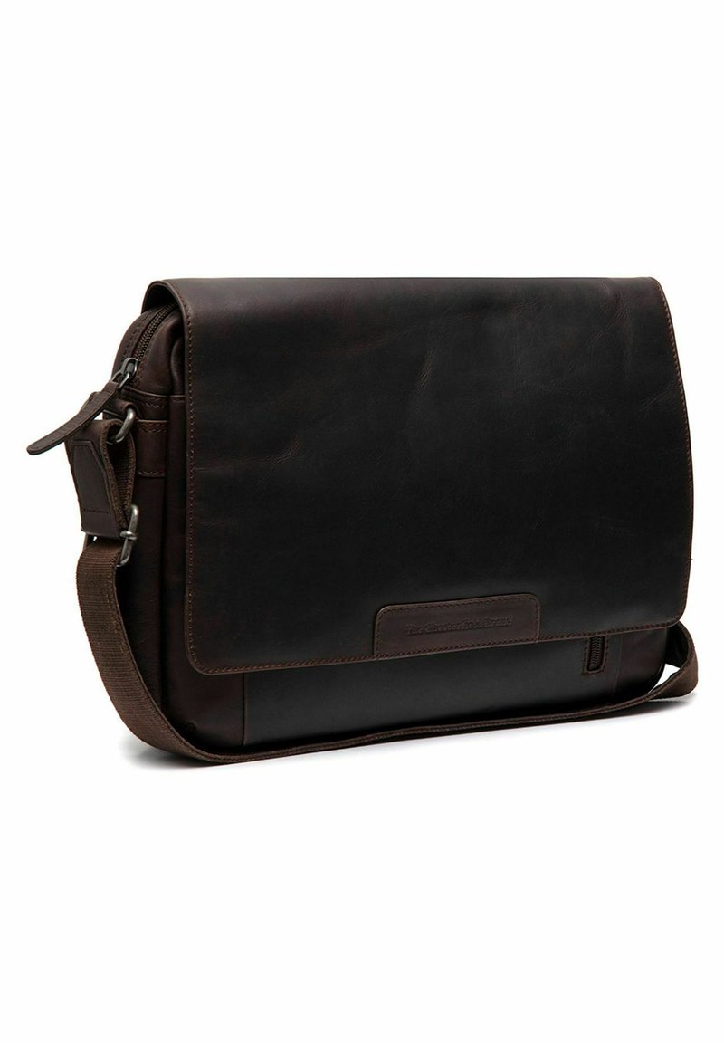 Dark brown leather messenger bag with a flap closure, adjustable strap, and front pocket. Smooth texture and minimalist design.