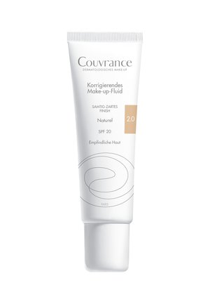 Couvrance corrective makeup fluid in a white squeeze tube; features a smooth finish, labeled "Naturel 2.0," and offers SPF 20 protection.
