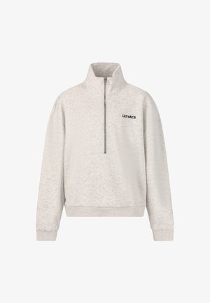 Lys grå sweatshirt med høj krave, halv-zip og ribbet manchetter. Har teksten "LES'ARCS" i sort på brystet. Blød tekstur.