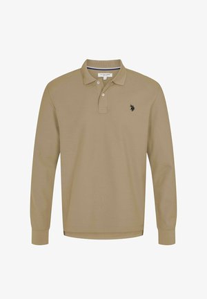 Polokošile s dlouhým rukávem v béžové bavlně s modrým lemováním límce, s dvouknoflíkovou légou a vyšívaným logem na levé straně hrudi.