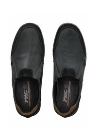 Black leather slip-on shoes with a smooth finish, rounded toe, contrasting stitching, and brown accents at the heel.