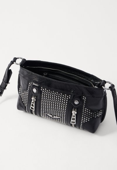 Black leather handbag with silver studs and zippers. Features a textured surface, adjustable strap, and multiple zippered compartments.