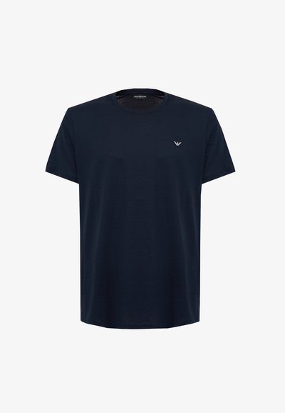 T-shirt in cotone blu navy con maniche corte, scollo rotondo e un piccolo logo sul petto. Tessuto morbido, vestibilità casual.