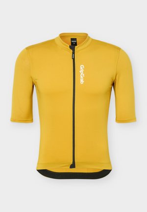 Maillot de ciclismo amarillo mostaza de manga corta con cremallera negra frontal y logo blanco "GripGrab" en el pecho.