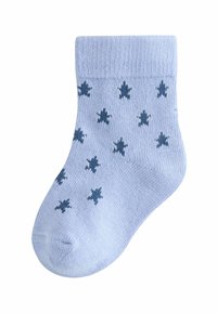 Soc cu bumbac de culoare albastru deschis, cu un manșon cu nervuri și un model de forme de frunze de culoare albastru închis. Textură netedă, cu vârful întărit.