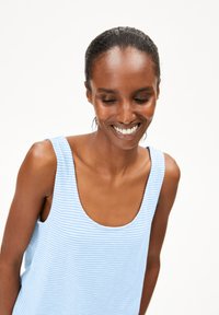 Light blue striped tank top with a scoop neckline and wide straps. Soft fabric with a subtle texture. No notable embellishments.