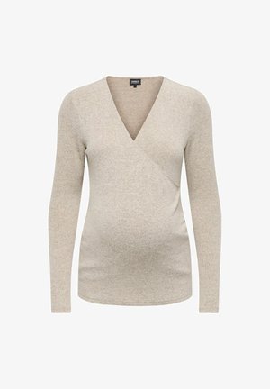 Bež majica za nosečnice z dolgimi rokavi, izdelana iz mehkega in elastičnega materiala, z V-izrezom in zavitjem, ki ima gladko teksturo in prilegajočo se obliko.