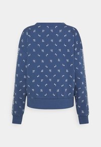 Donkerblauwe sweatshirt met wit bloemmotief, ronde hals, lange mouwen, geribbelde manchetten en zoom. Zacht materiaal met een ontspannen pasvorm.