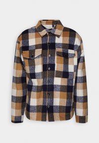 Rutigt flanellskjorta med stora rutor i brun, marinblå, vit och guld; knäppning fram, två bröstfickor och bred krage.