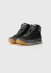 Black and gray hiking boots with a suede and rubber upper, featuring a rounded toe, lace-up front, and a gum rubber outsole.