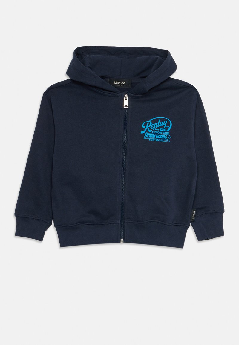 Námornícky zipsový hoodie vyrobený z bavlny, s prednou kapsou, rebrovanými manžetami a svetlomodrým logom na hrudi. Hladká textúra.