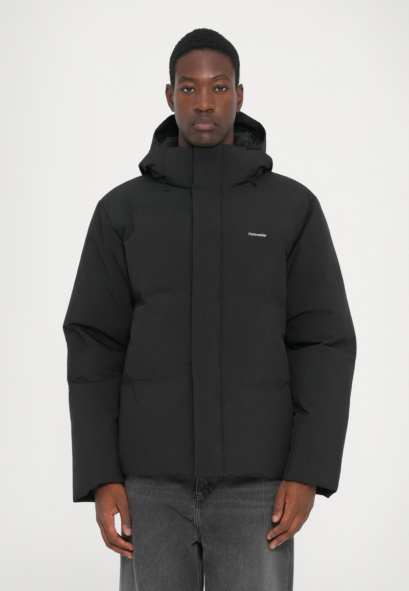 Black puffer jacket with a high collar and adjustable hood, featuring a smooth texture and minimal branding on the chest.