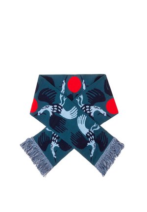 Dziany szalik w kolorze morskim z wzorem ptaka i słońca w czerwieni i granacie. Wykończony frędzlami dla tekstury.