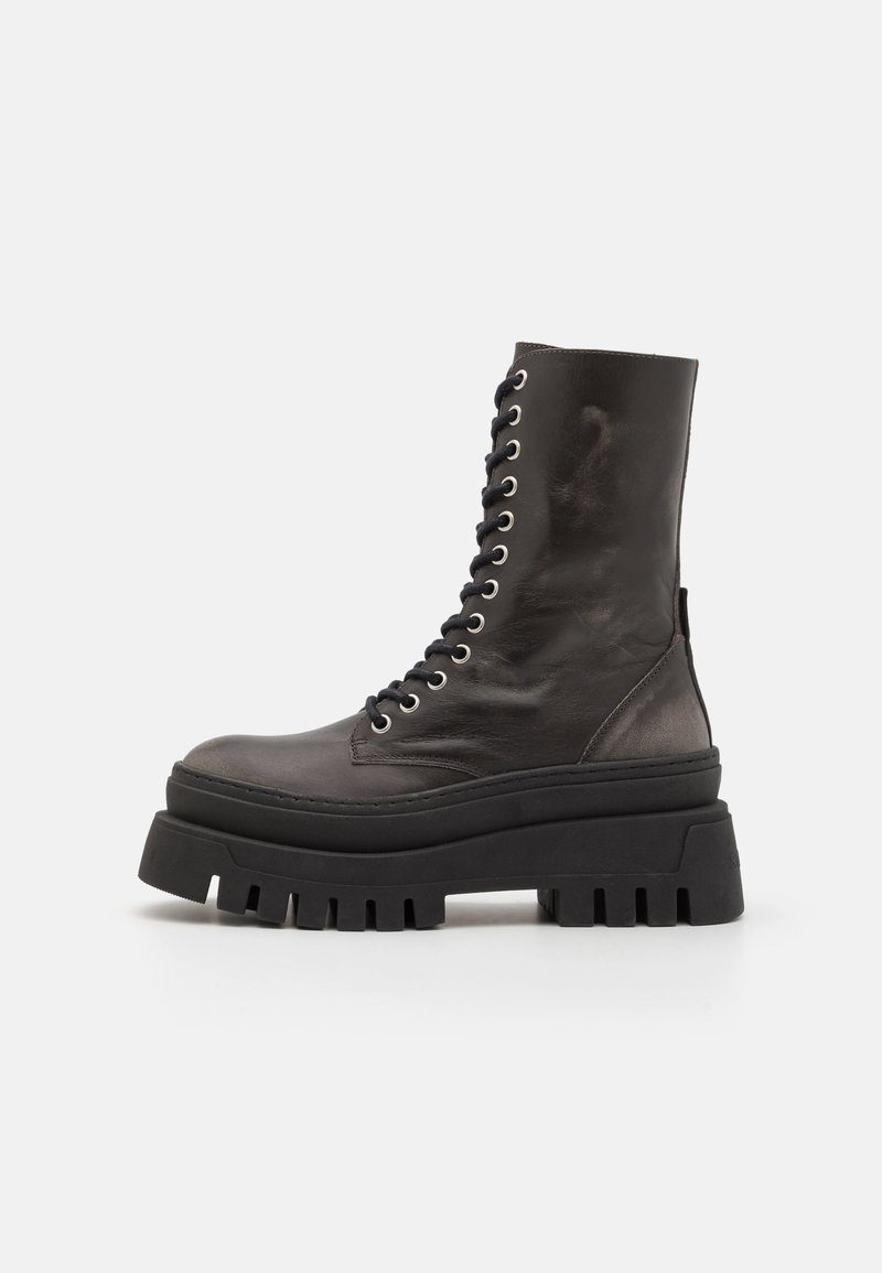 Black leather ankle boots with a chunky platform sole, round toe, and metal eyelets for laces. Textured finish adds visual interest.