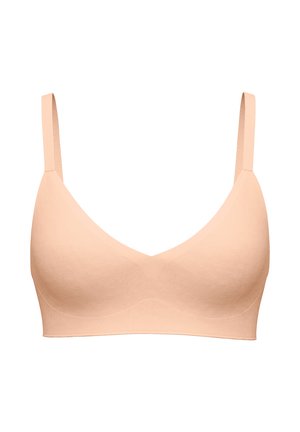 Naadloze beige nude beha met dunne verstelbare bandjes en licht gevoerde cups, ontworpen voor comfort en ondersteuning.