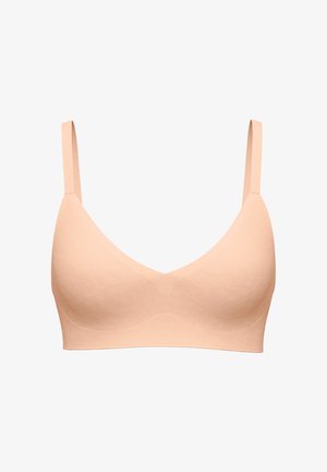 Seamless nude beige bra with thin adjustable straps and lightly padded cups designed for comfort and support.