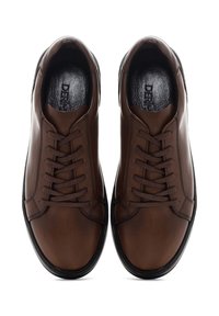 Pair of brown leather lace-up casual shoes with black soles shown from above on white background.