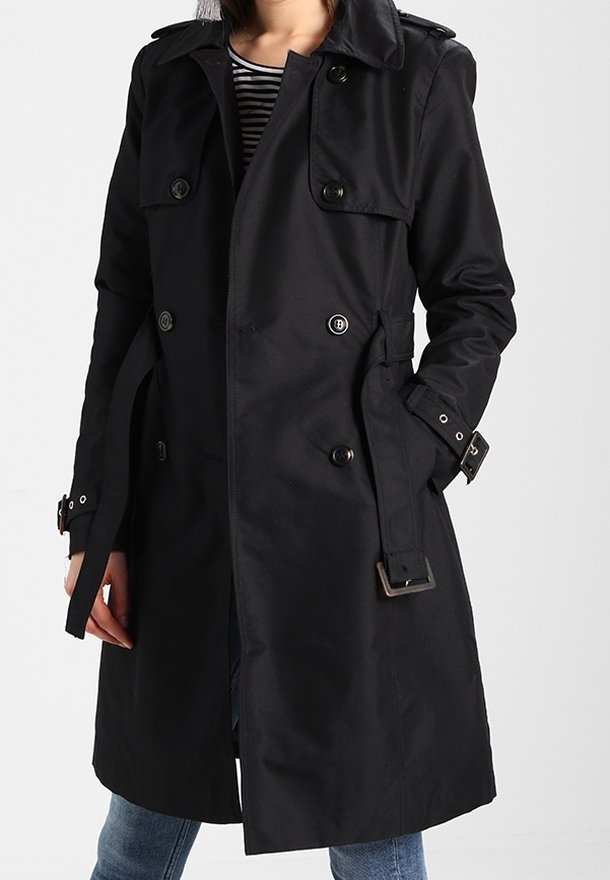 Black trench coat, knee-length, double-breasted with buttons, wide lapels, belted waist, and adjustable cuffs. Smooth, structured fabric.