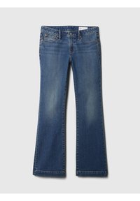 Blå utsvängda jeans i denim med ljus blekning. Har framfickor, en knapp- och dragkedjeslutning samt en rak midja.