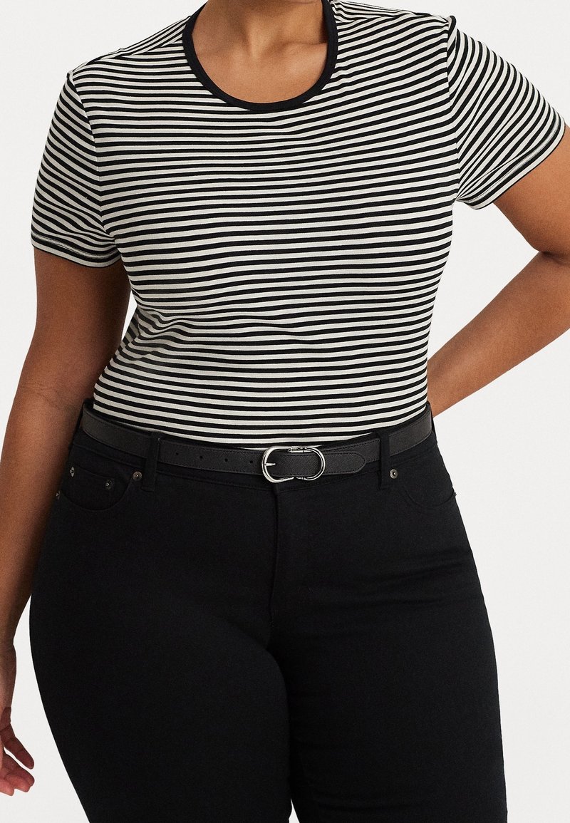 Black and white striped short-sleeve t-shirt with a round neckline, paired with high-waisted black jeans and a black belt featuring a silver buckle.