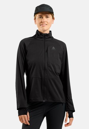 Black athletic jacket made of lightweight material, featuring a zip front, high collar, and thumbholes. Minimal branding on chest.