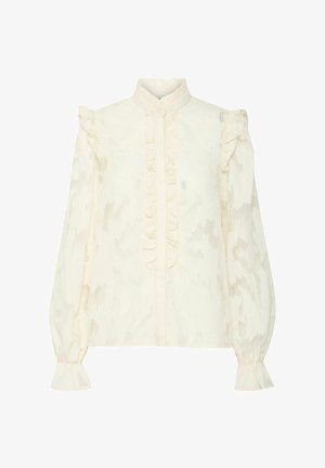 Blouse crème avec un col froncé haut et une fronce décorative sur le devant. Manches longues et bouffantes avec des poignets évasés. Motif de tissu texturé.