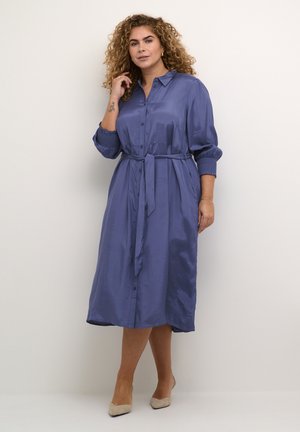 Lavender satin long dress with button closure, tie belt, and elastic cuffed sleeves. Smooth texture and below-the-knee length.