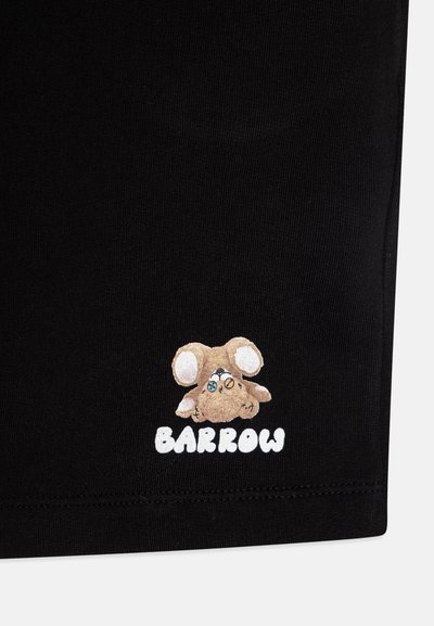 Black fabric features a small, cartoonish brown animal graphic with big ears and a face, next to the text "BARROW" in white letters.