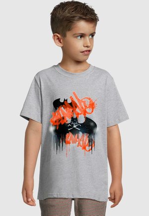 Gray cotton t-shirt featuring a Batman graphic with orange graffiti splashes and black accents, short sleeves, and a relaxed fit.