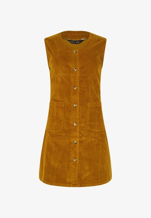 Ärmelloses Cordkleid in senfgelb, mit rundem Ausschnitt, Knopfverschluss auf der Vorderseite und zwei aufgesetzten Taschen. Textilstruktur.